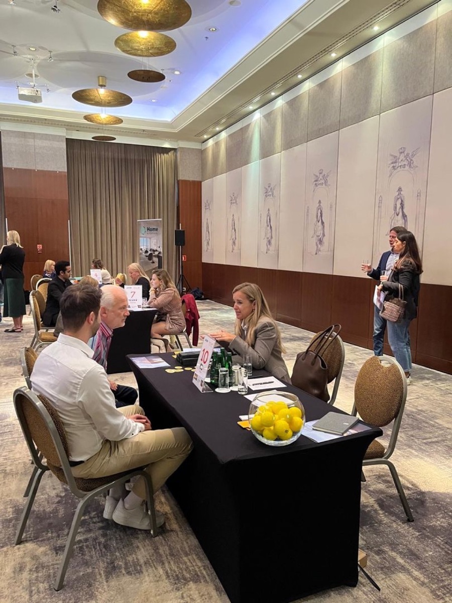 Buyers and suppliers seated across small tables at the Polish–Egyptian Chamber B2B session in a Warsaw hotel ballroom.